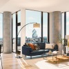 floor-to-ceiling windows brighten spacious living room